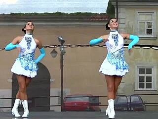 Two Attractive Majorettes Perform Cheerleading Routine Enthusiastically