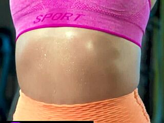 Fit petite lady performs in the gym