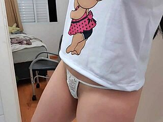 the girl rubs her clit while twerking in her tiny thong