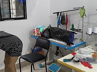 An Indian seamstress indulges in personal pleasure at work