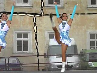 Two Attractive Majorettes Perform Cheerleading Routine Enthusiastically