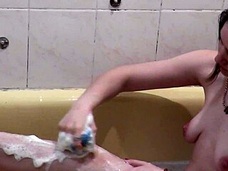 Assol Bathes with Soapy Foam on Natural Curves