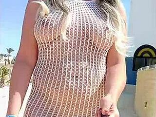 Check out this blonde in transparent dress without underwear flashing outdoors.