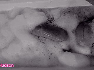Kity Hudson takes a bath and plays with a toy