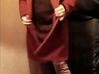 French milf maid bound in leather harness for outdoor display