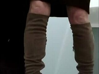 French milf maid bound in leather harness for outdoor display