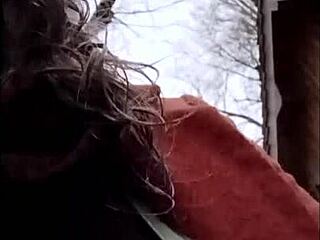 French milf maid bound in leather harness for outdoor display