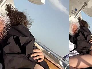 A girl is having fun with a guy on his yacht at sea