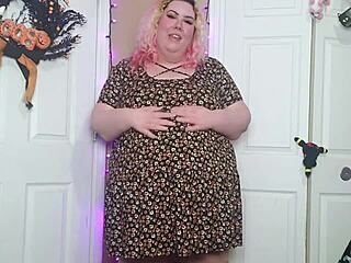 A desperate fat woman has an orgasm in a sun dress