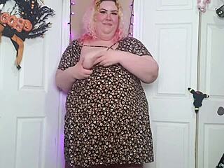 A desperate fat woman has an orgasm in a sun dress
