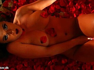 Denise Klarskov Touches Her Wet Pussy Among Red Roses