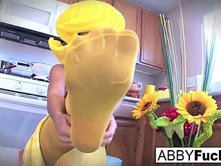 Surreal Kitchen Dress-Up: Abigail's Emotional Journey with Her Giant Cucumber, Revealing Big Tits and Pussy in the Kitchen.