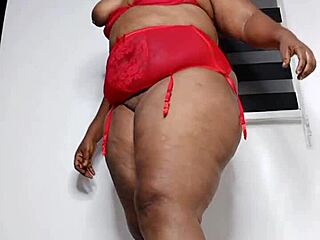 Curvy woman in sexy red underwear, teasing and playing