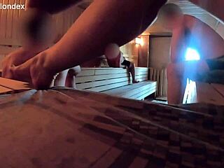 A wife is having a sauna and she is teasing other people there