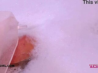 Super cute teen enjoys a relaxing bath interview on the sofa.