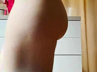 The petite blonde in tight jeans is dancing on the kitchen for you