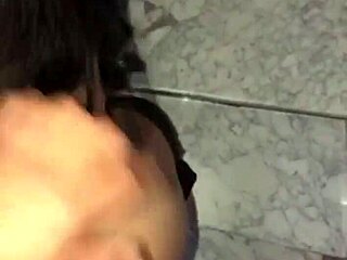 Couple enjoys intimate moments on the stairs, unseen