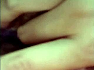 Asian woman spreads legs, uses toy in intriguing video