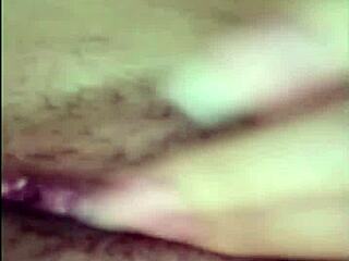 Asian woman spreads legs, uses toy in intriguing video