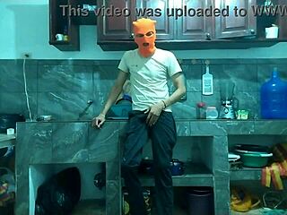 25-year-old man masturbates big cock from flaccid to erect in kitchen.