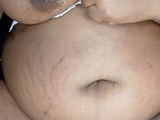 The ebony stepmother indulges in solo masturbation, her big pussy lips wet and ready for orgasm.