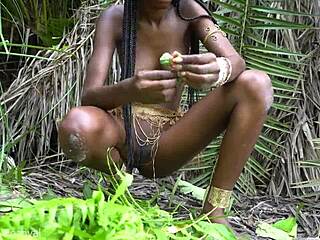 hot african native woman cooking in the jungle with small waist