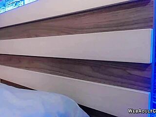 Japanese babe fingers her shaved pussy on webcam