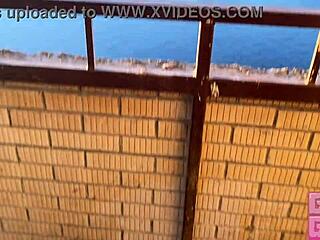 smoking girl gives fast blowjob on public balcony, want to watch?