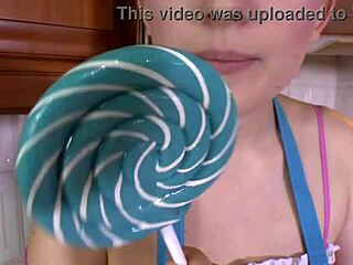 Beautiful brunette sucks lollipop in high heels moaning loudly!