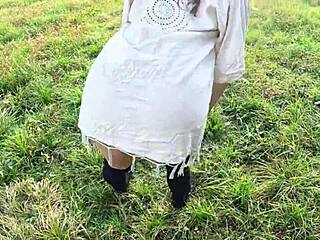 beautiful curly girl strips naked for neighbors in nature