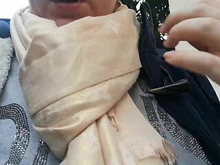 European woman flashes tits in public garden then wets pants