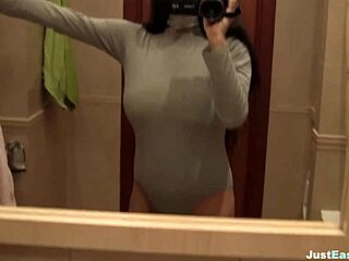 I watched the busty babe finger her hairy pussy in the bathroom