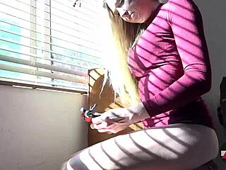 tall blonde giantess in heels rides toys amidst balloons