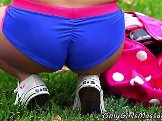 Feeling the passion in an outdoor lesbian massage session.