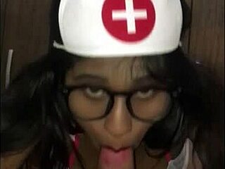 A young Latina nurse cares for her patient in the hospital.