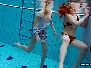 Two hot lesbians enjoy pool underwater
