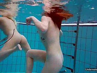 Two hot lesbians enjoy pool underwater