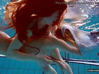 Two hot lesbians enjoy pool underwater