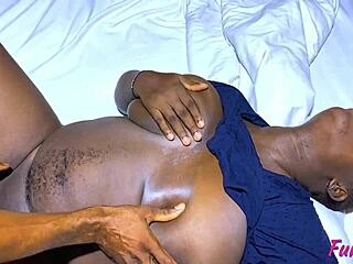 Busty black babe flashes tits in bathroom and kitchen close-up.