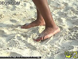 Petite brunette teen giggles with sandy feet at the beach in dirty fetish play