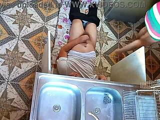 Unfaithful wife sneaks passionate encounter with plumber in kitchen