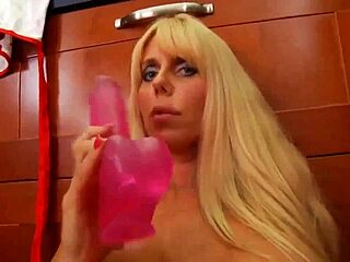 Karen plays with her toys in the kitchen, exploring every curve.