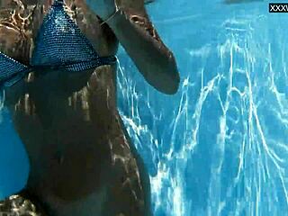 Beautiful big tits Hungarian babe Angelica Heart dives underwater in bikini at pool