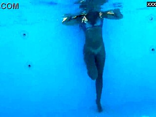 Beautiful big tits Hungarian babe Angelica Heart dives underwater in bikini at pool