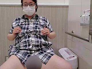 A married woman sneaks away to pleasure herself intensely in a store toilet.