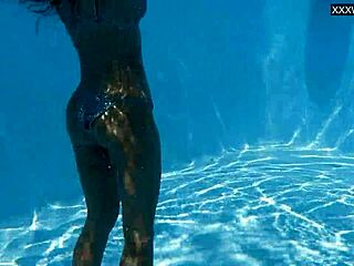 Beautiful big tits Hungarian babe Angelica Heart dives underwater in bikini at pool