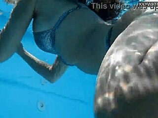 Beautiful big tits Hungarian babe Angelica Heart dives underwater in bikini at pool