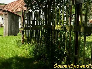 redhead gets pissed on and cum sprayed in outdoor group fun