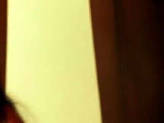 lovely brunette dances gracefully in sensual striptease