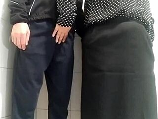 gorgeous milf with big natural tits and curvy ass jerks me off until cum covers her in public toilet.